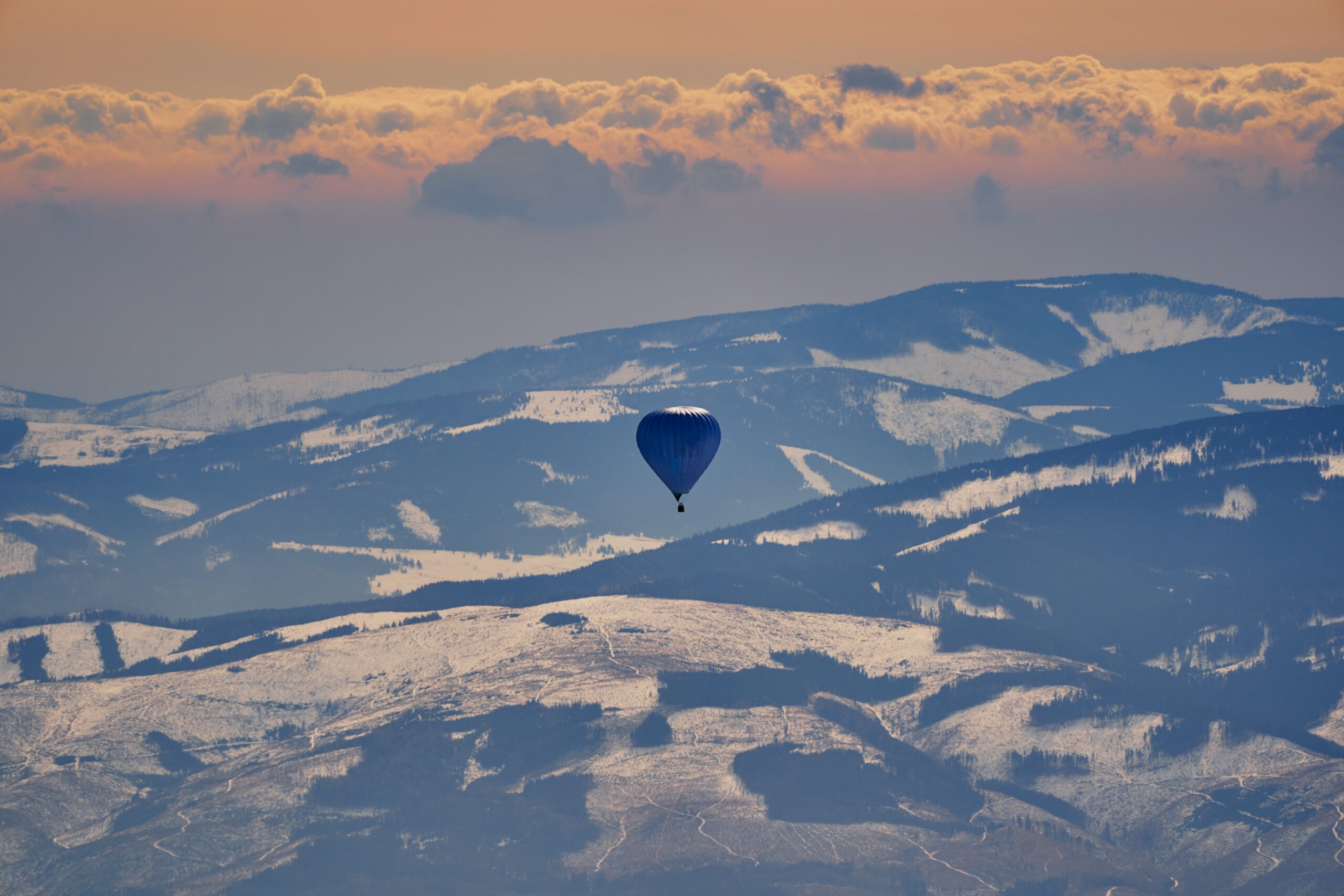 high-tatras-mountains-and-hot-air-balloon-in-slova-2023-11-27-05-09-40-utc-scaled